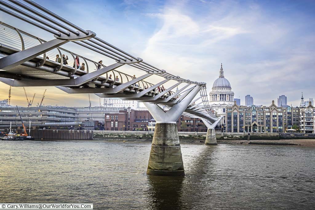 The Millennium Bridge, also known as the Wobbly Bridge, across the River Thames with St Paul's cathedral in the background.