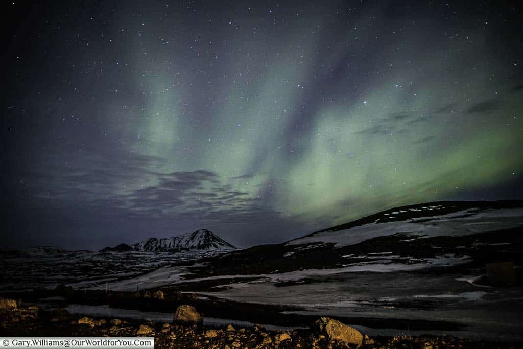 The blue/green sky of the dancing Northern Lights display at Reykjahlíð,