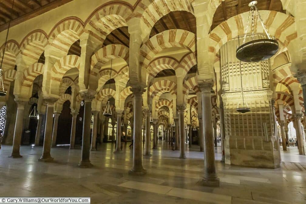 The decorative moorish arches of the Mosque–Cathedral of Cordoba.