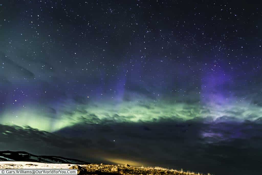 The result of a long exposure shot over Reykjahlíð that captured colours in the sky that was barely noticable to the human eye.