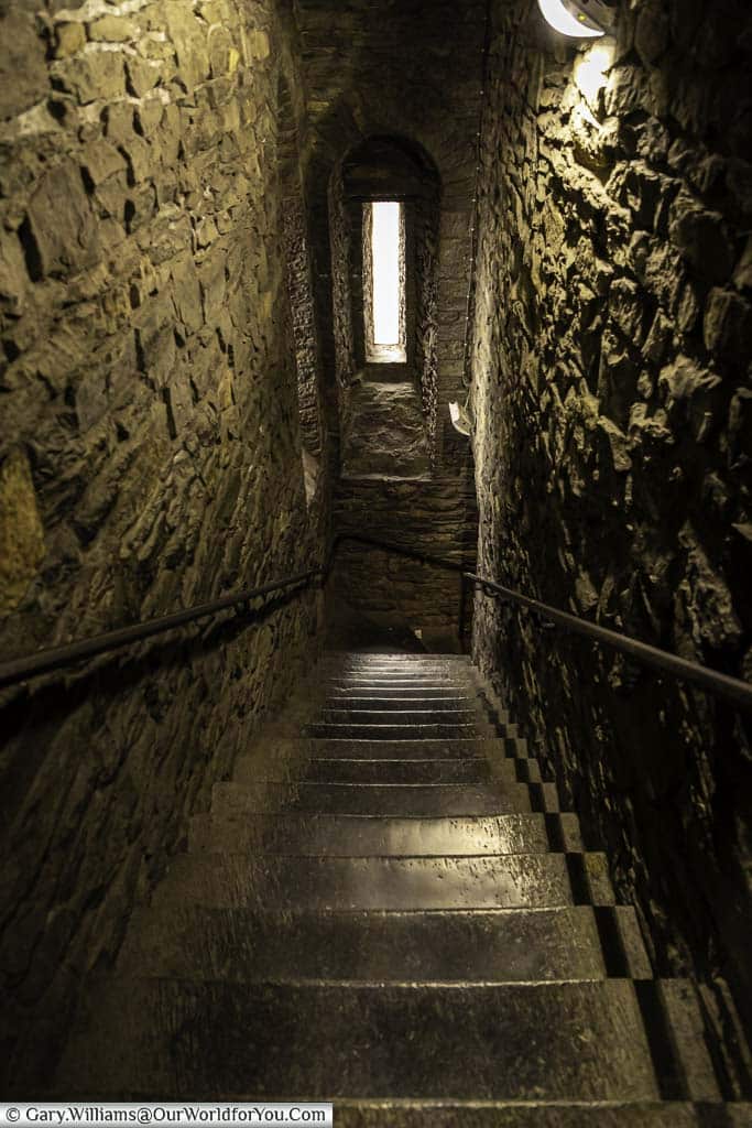Narrow stone steps leading down from the rooftop in the Castle of the Counts in ghent, belgium