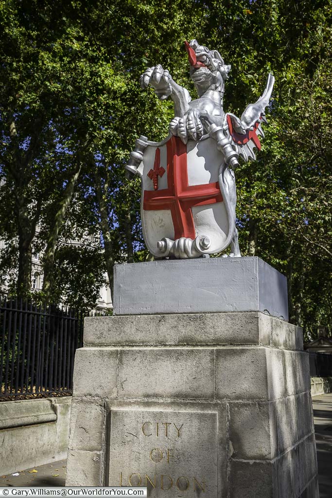 The pewter coloured dragon with bright red tongue holding shield displaying the coat of arms of Saint George signifies the entrance to the City of London.