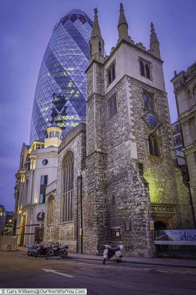 A view of 30 St Mary Axe behind St Andrew Undershaft Church after the sun has done down.