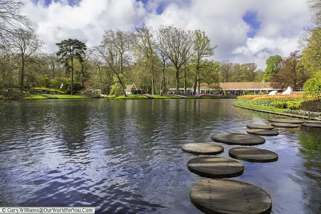 Stepping stones across the lake at keukenhof gardens in holland