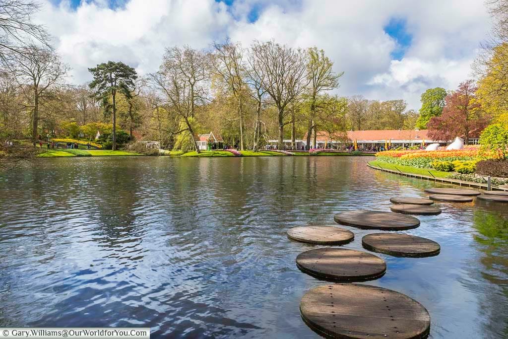 Stepping stones across the lake at keukenhof gardens in holland