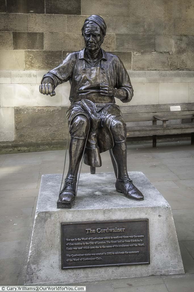 A brass statue to a cordwainer, or shoemaker, to designate the area known as the Ward of Cordwainer