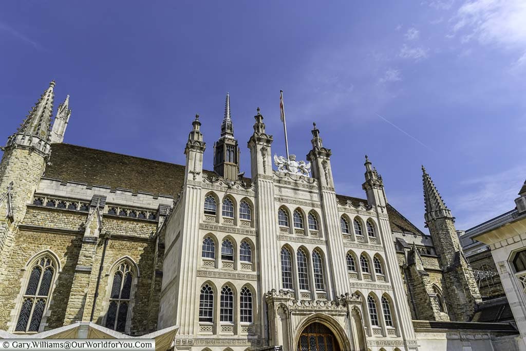 The exterior of the Guildhall in the City of London under a deep blue sky