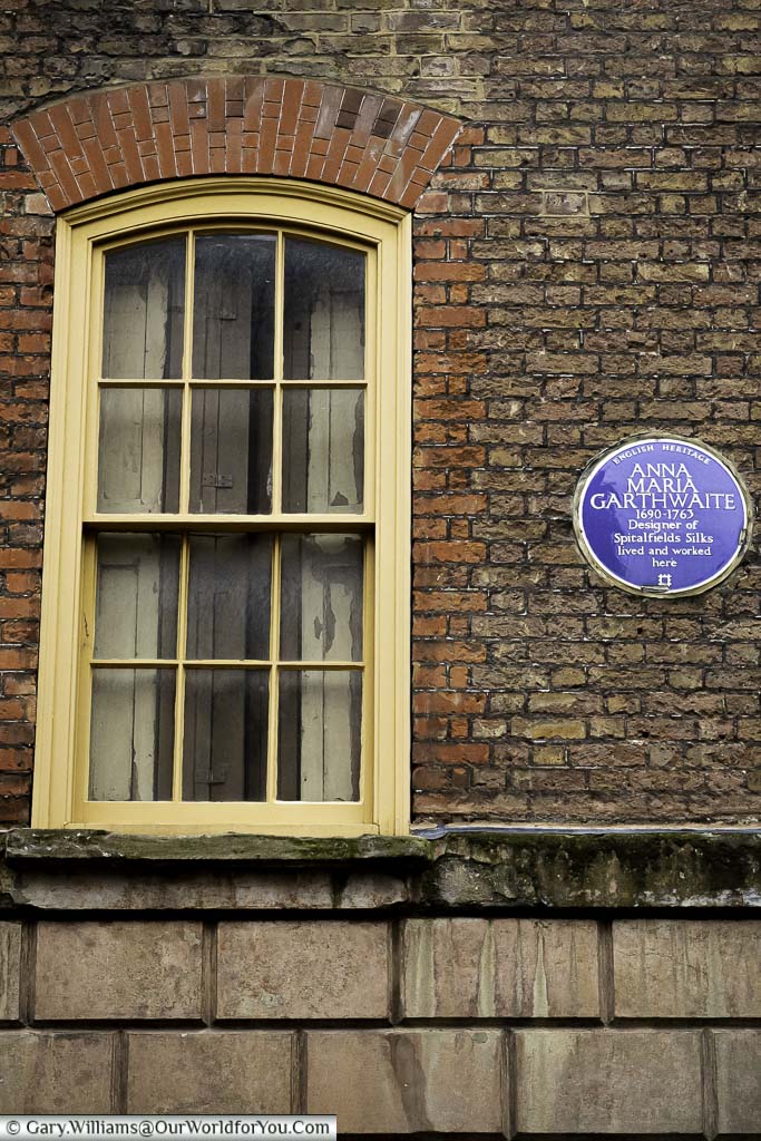 An English Heritage Blue plaque to Anna Maria Garthwaite, designer of Spitalfields Silks in Princelet Street in the 18th century.