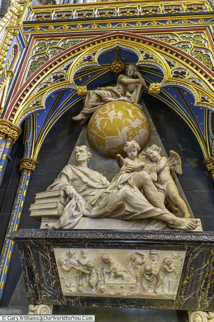 An ornate monument to Sir Isaac Newton in the quire screen of westminster abbey in london