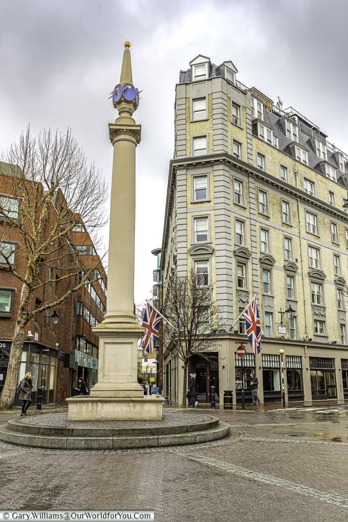 The column at the centre of Seven dials. A junction where seven roads meet. Don't count the dials at the top of the column as you will notice there are only 6.