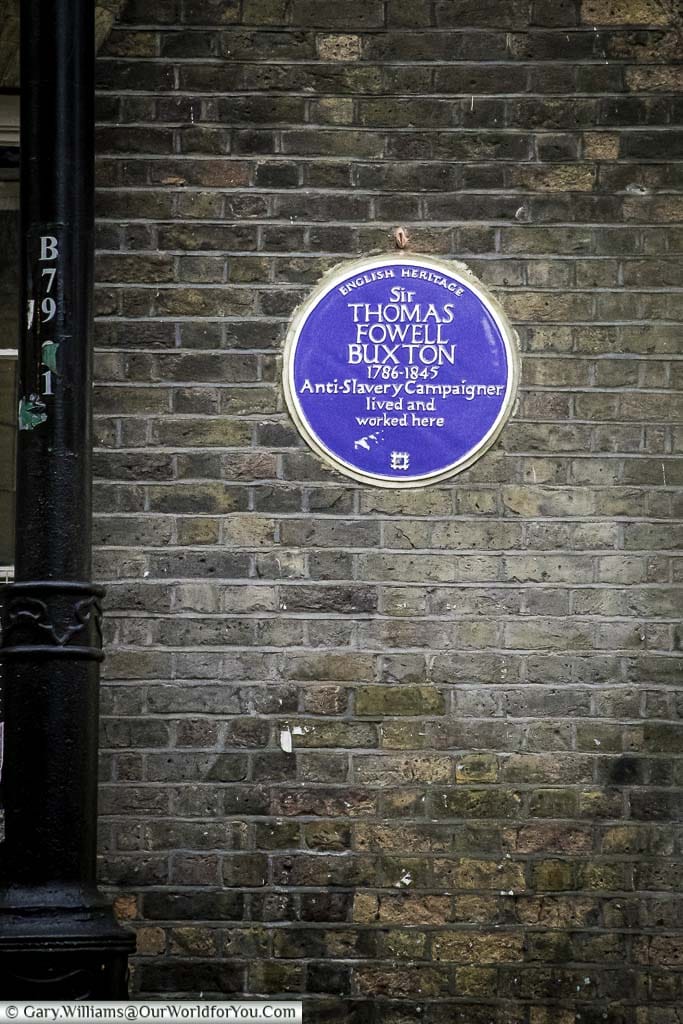 A blue plaque, issued by English heritage, to Sir Thomas Fowell Buxton, Anti-Slavery campaigner along Brick Lane.