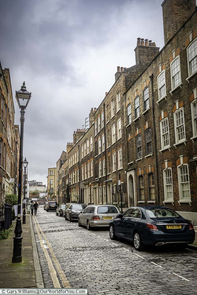 The elegant Elder Street in the Spitalfield district with its traditional Georgian homes, and cast-iron street lamps.