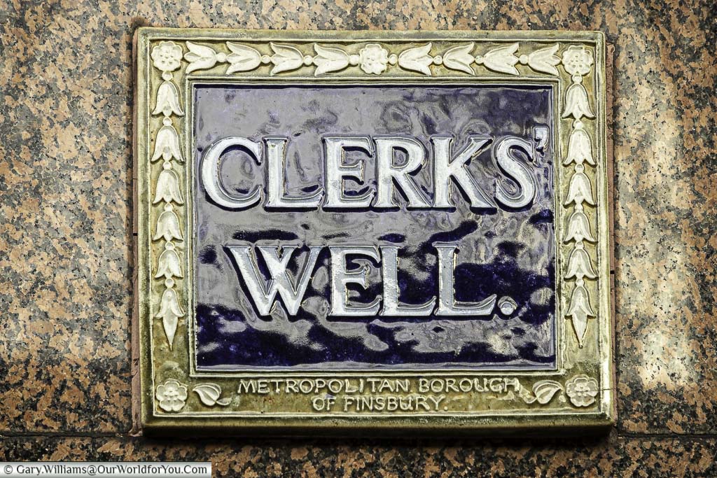 A tiled blue plaque from the Metropolitan Borough of Finsbury indicating the site of Clerks’ Well