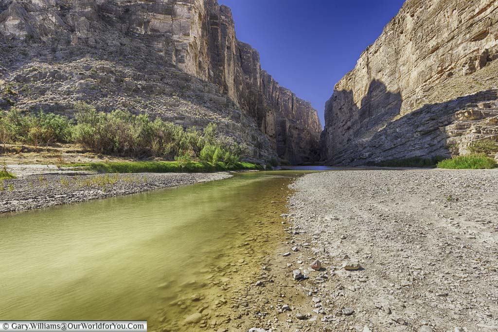 The Rio Grande river where it is a trickle between the steep edges of a gorge in the Big Bend National Park in Texas