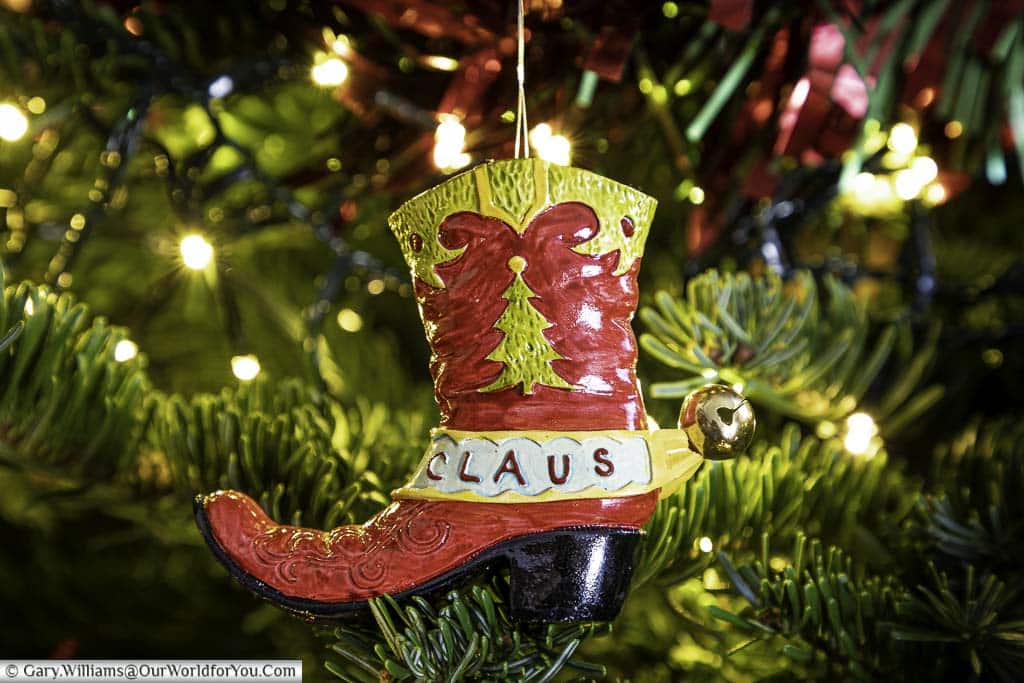 A cowboy boot Christmas decoration from Texas hanging on our Christmas tree