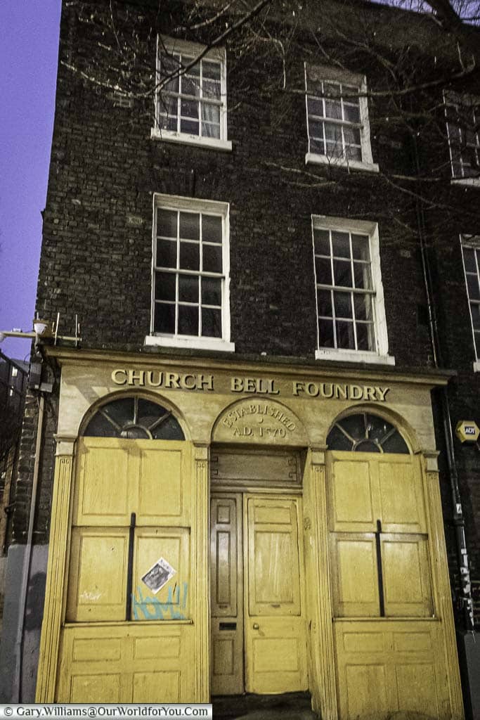 The yellow frontage to the Church Bell Foundry, also know as the Whitechapel Bell Foundry, the shutters are up as the business has moved out.