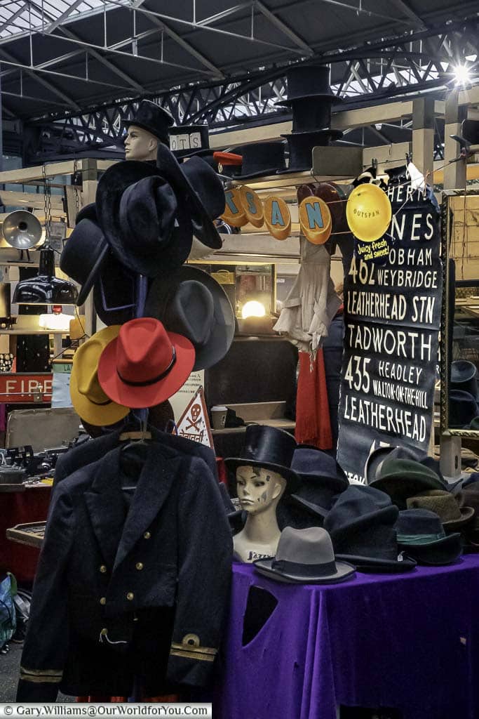 A hat stall on Spitalfields market, selling a wide range of second-hand headwear.