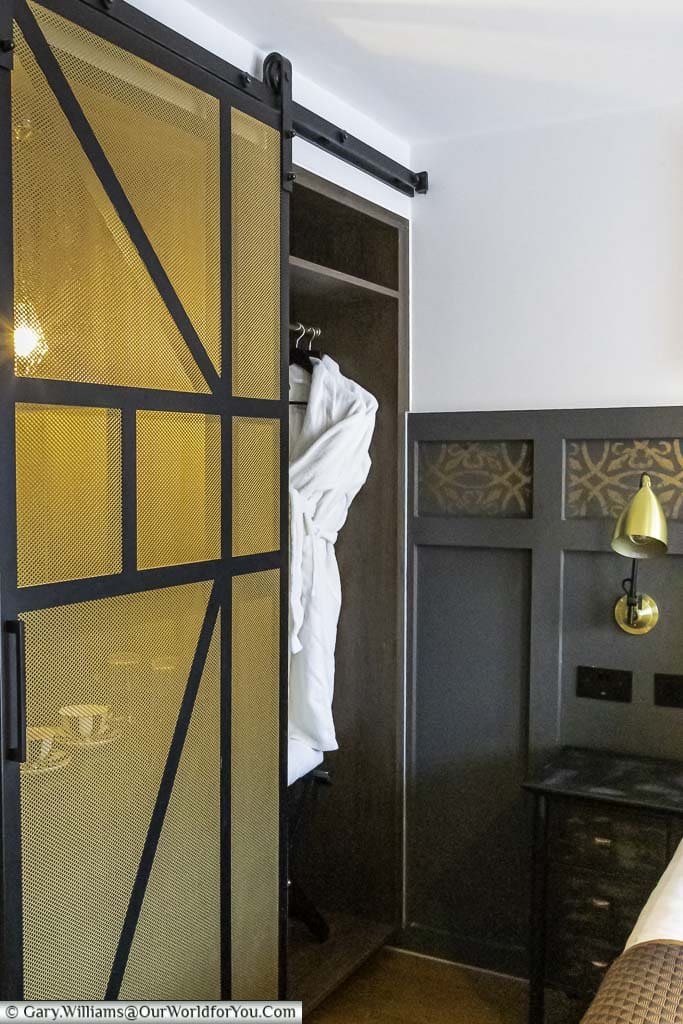 Bathrobes hanging in the wardrobe of our king deluxe room at the hotel indigo chester