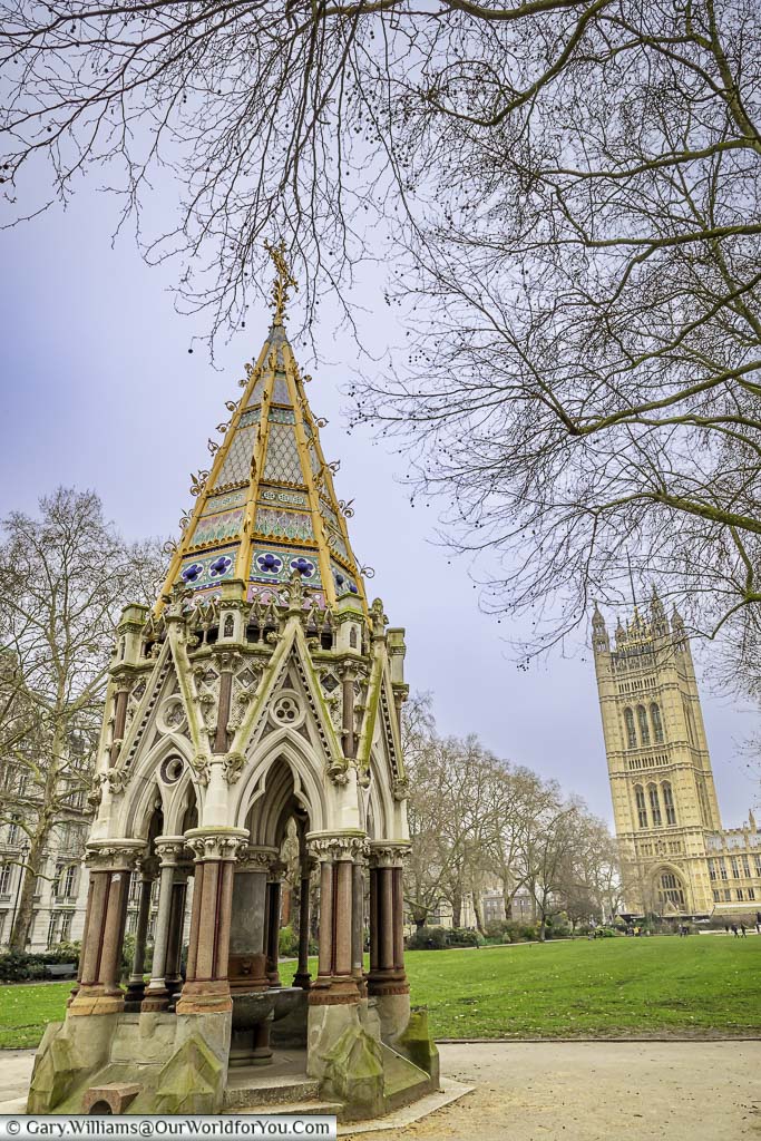 The Buxton Memorial Fountain, a communal water fountain covered by a decorative neogothic spire, set in Victoria Tower Gardens, next to the Palace of Westminster.
