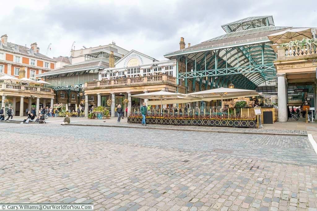 A look at covent garden market in london from the piazza in front of st paul's church