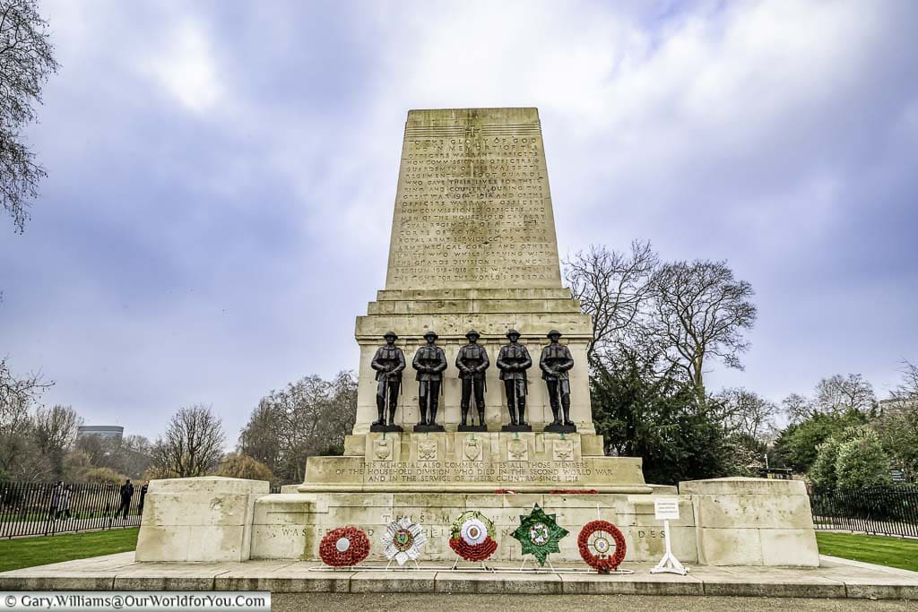 A portland stone memorial, with five statues of near-identical soldiers, to those of the Guards Division who lost their lives in World War One.