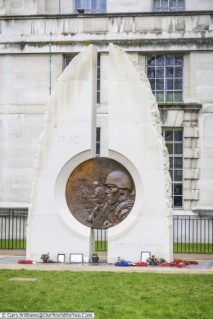 The Iraq and Afghanistan Memorial in Victoria Embankment Gardens. It consists of two Portland monoliths with a bronze medallion mounted between them.