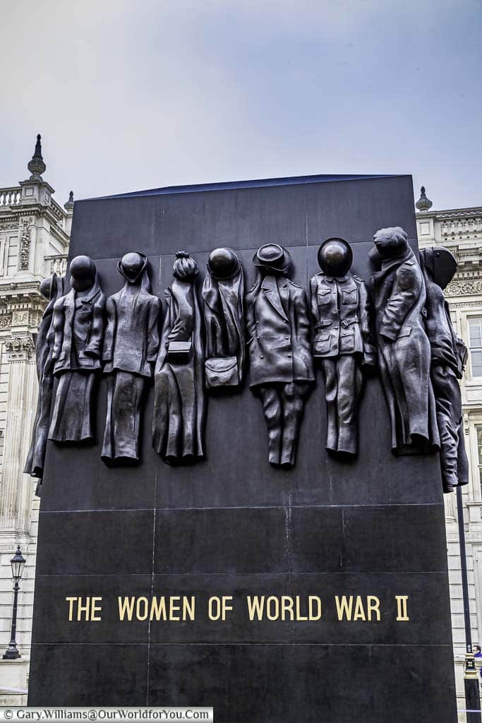 Monument to the Women of World War Two in Whitehall. The black monolith features various uniforms hanging that represent the different roles women played in the Second World War,