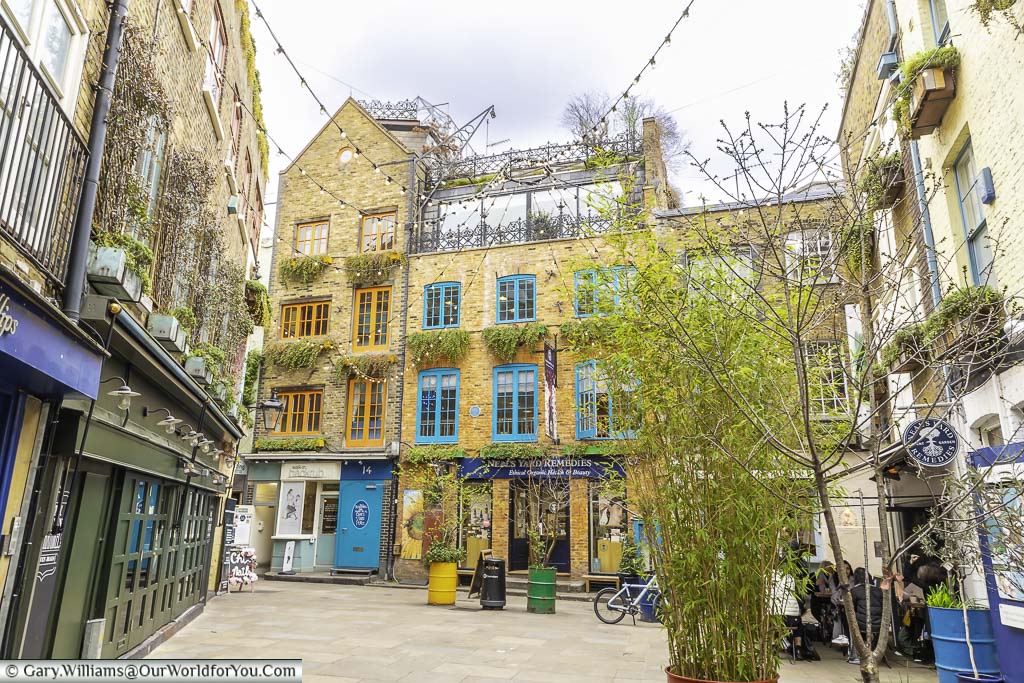 The little courtyard that is neal’s yard, lined by three storey former warehouses in london's covent garden