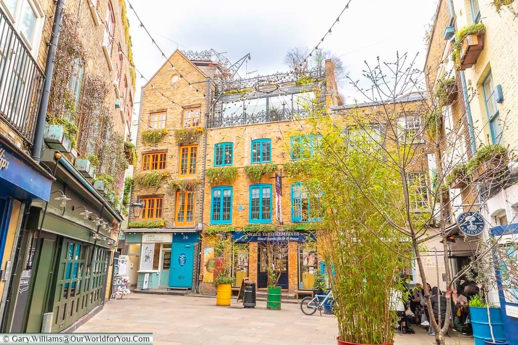 The little courtyard that is neal’s yard, lined by three storey former warehouses in london's covent garden