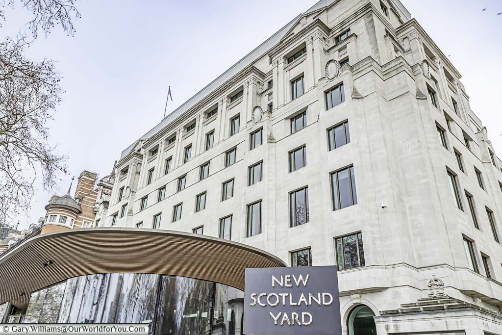 The iconic rotating sign for New Scotland Yard, in from of the home of the Metropolitan Police, at its home on the banks of the River Thames in Westminster.