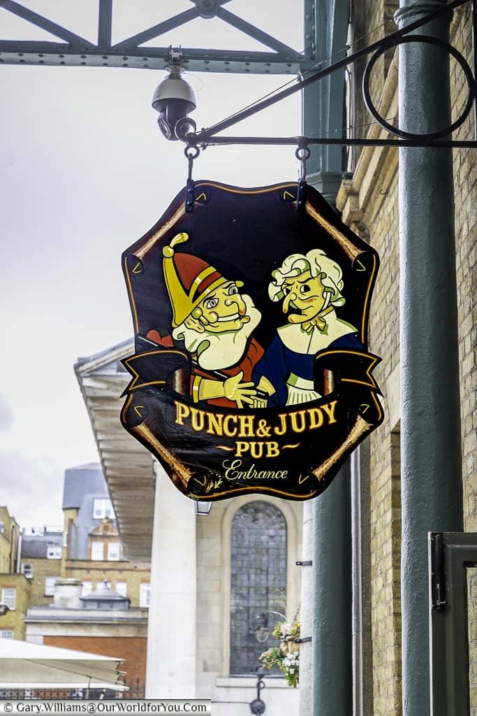 The had painted sign for the punch and judy pub in london's covent garden