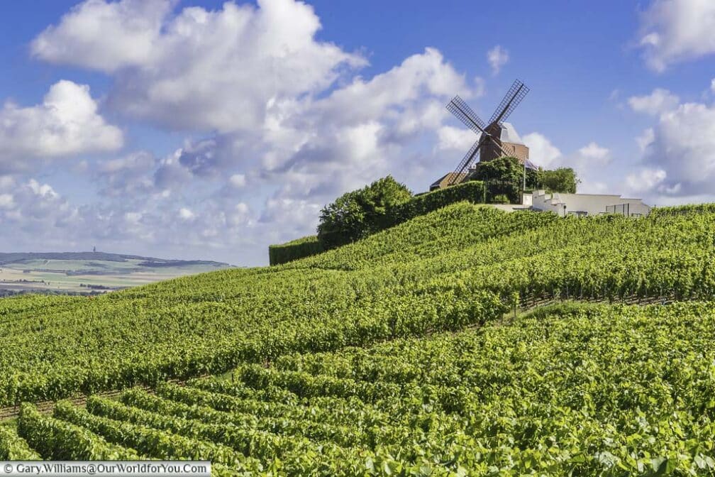 The G.H. Mumm windmill sits atop a hill covered in grape vines in the sleepy french town of Verzenay in the champagne region of france