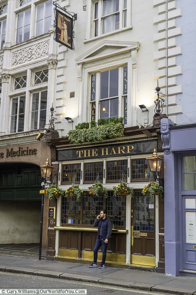 The front of the historic harp pub on chandos place, on the outskirts of london's covent garden district.