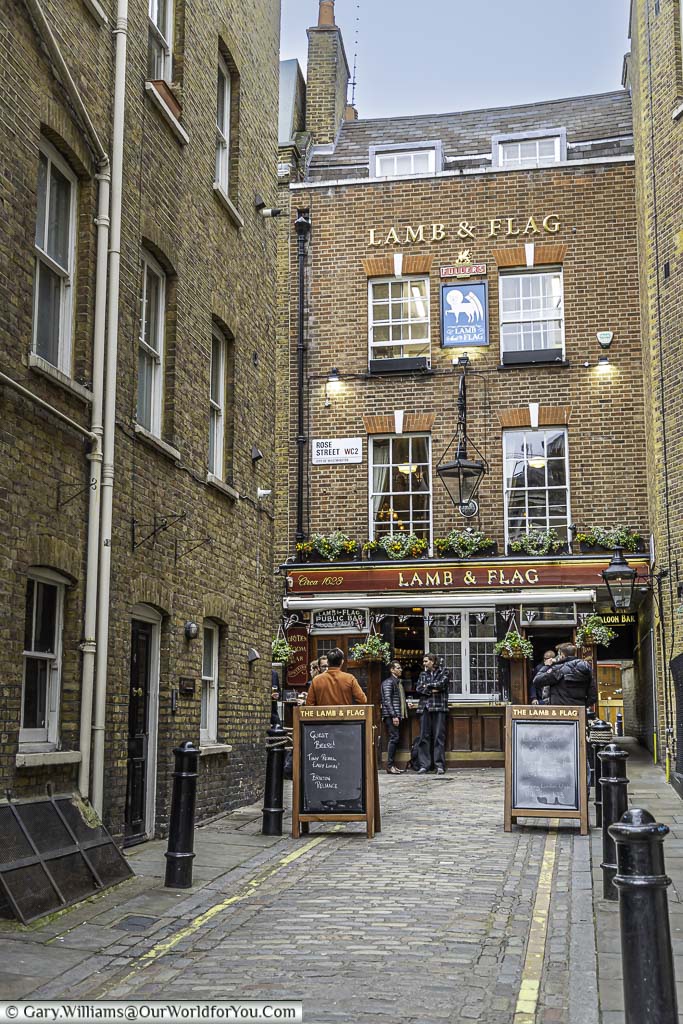 The historic lamb and flag pub at the end of the cobbled, pedestrianised, Rose street in london's covent garden district.