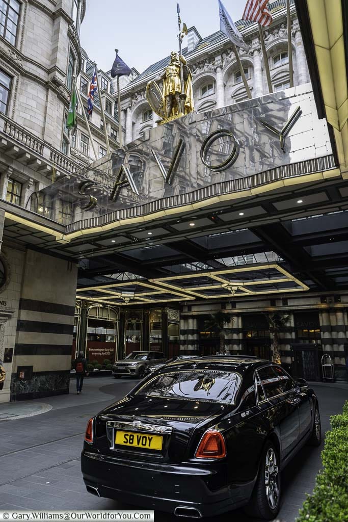 The entrance to the Savoy hotel with the hotel's Rolls Royce with the licence plate S8 VOY