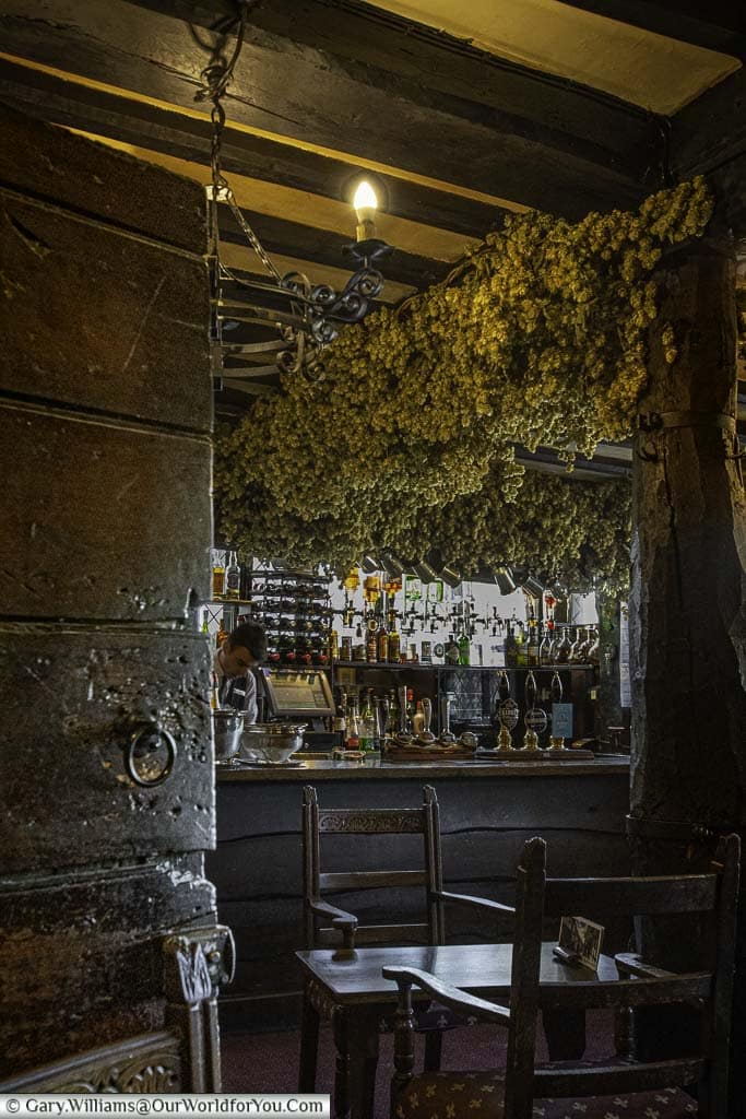 The rustic-looking medieval Giants' bar with dark heavy timbers and dried hops hanging from the ceiling