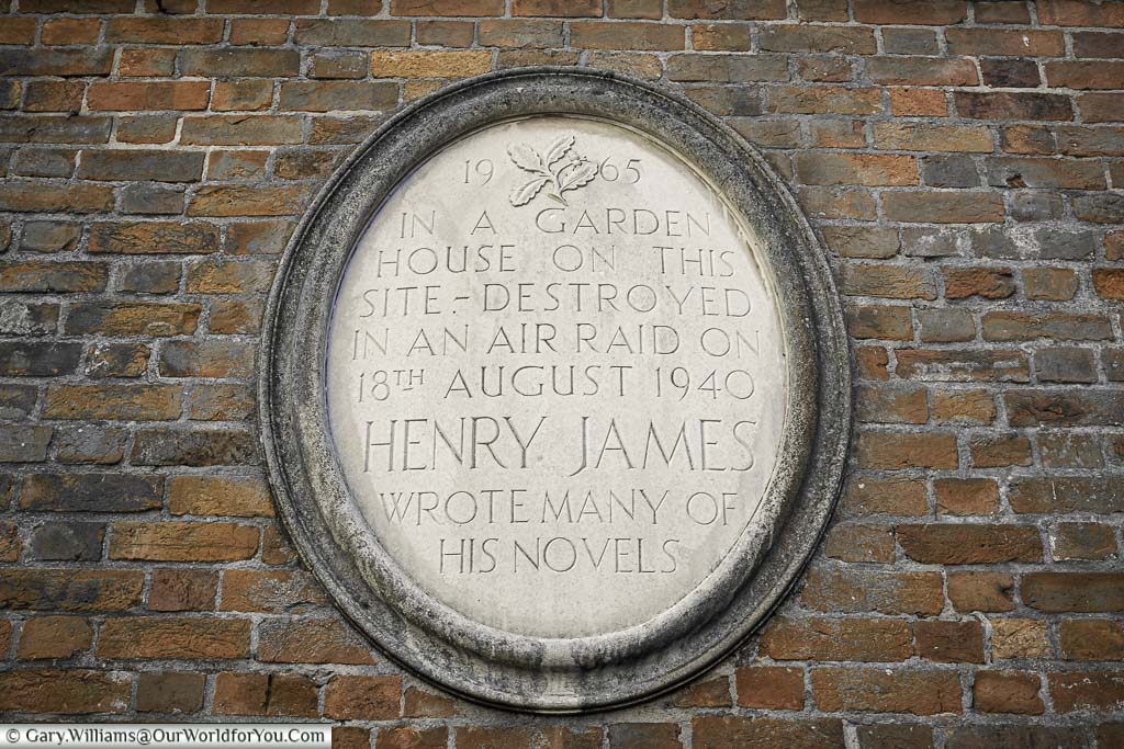 A stone plaque on the walled garden of Lamb House in rye, east sussex, to the author Henry James, who wrote his notable work in the house.