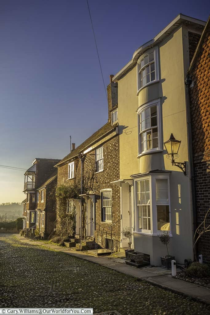 the historic Watchbell Street in rye, east sussex, bathed in the golden light of dusk