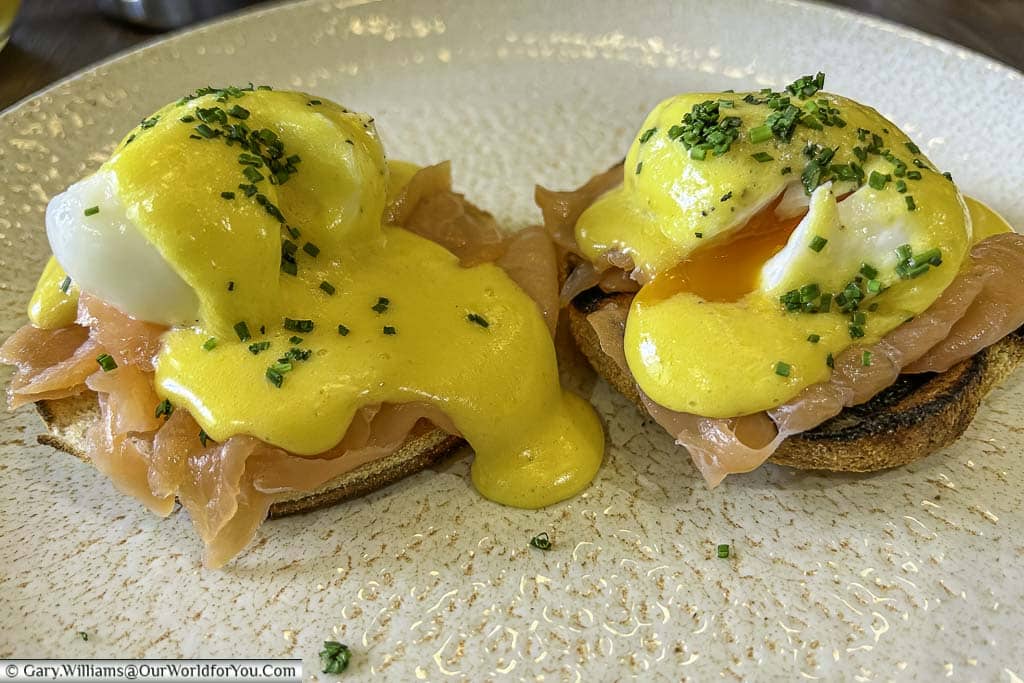 An eggs royale breakfast consisting of poached eggs on smokes salmon on toasted muffins napped with hollandaise sause at the hotel indigo chester