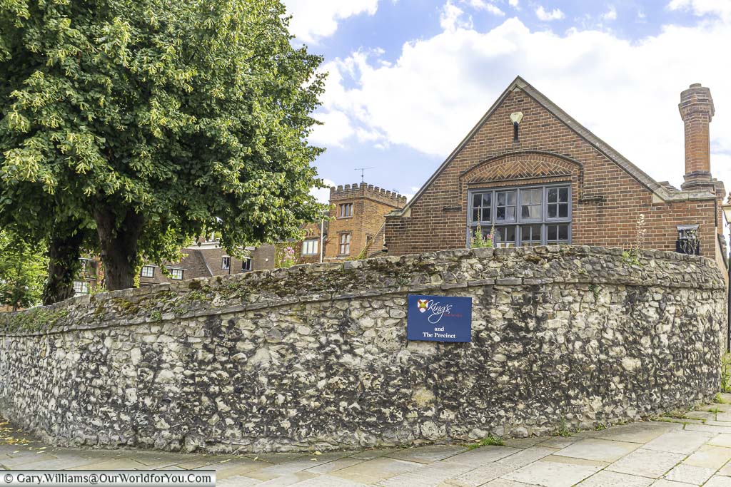 A robust stone wall in front of The King’s school in Rochester Kent.