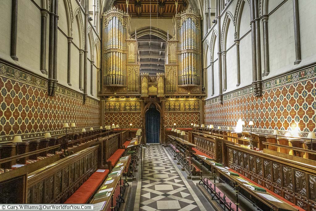 A look along the seating of the quire towards the organ, with it's ornate pipework in rochester cathedral