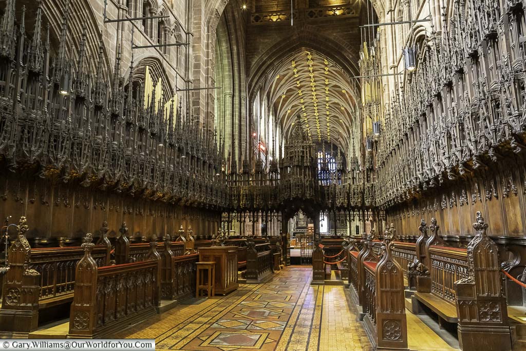 The ornate dark wood quire within chester cathedral