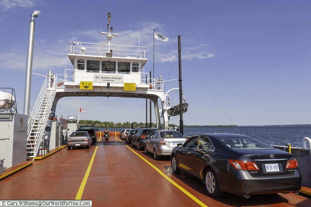 On a small open deck car ferry travelling through Canada on a road trip