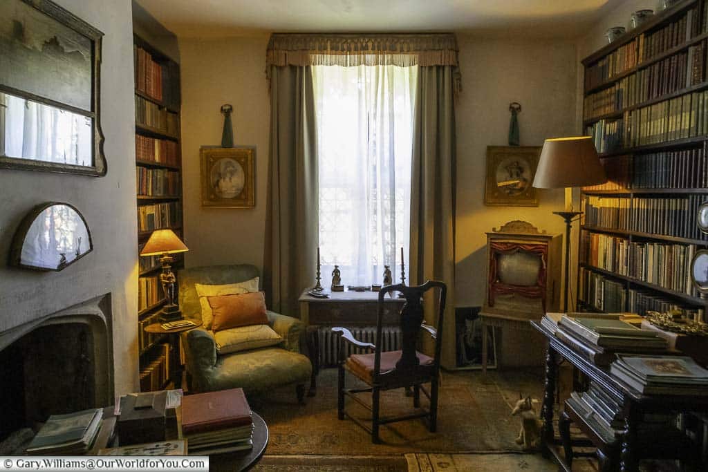 The small, private-looking, book room within the national trust nymans house in west sussex