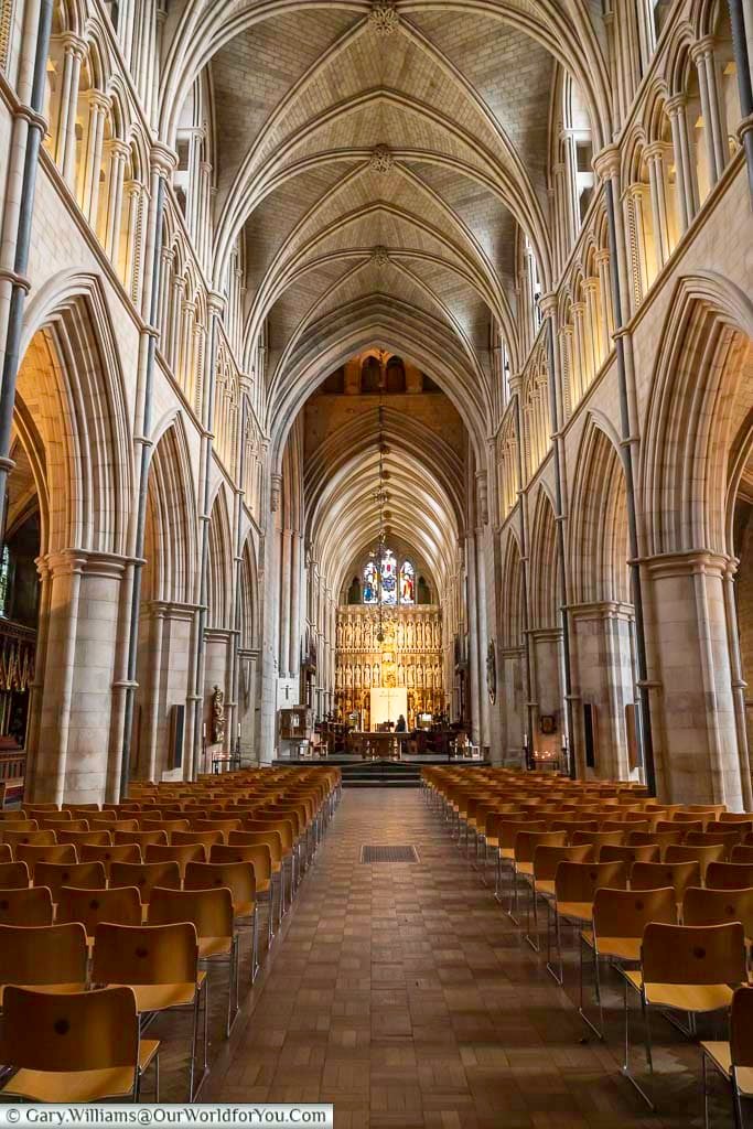 The nave of southwark cathedral on london's bankside with its tall stone vaulted ceiling