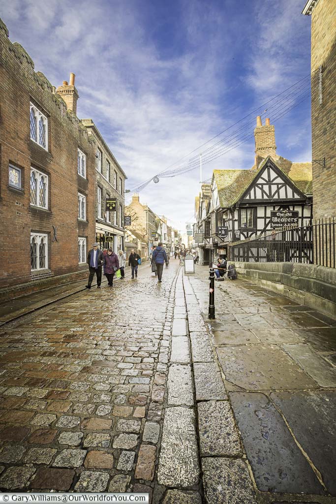 The cobbled High Street of Canterbury as it crosses the Great Stour River