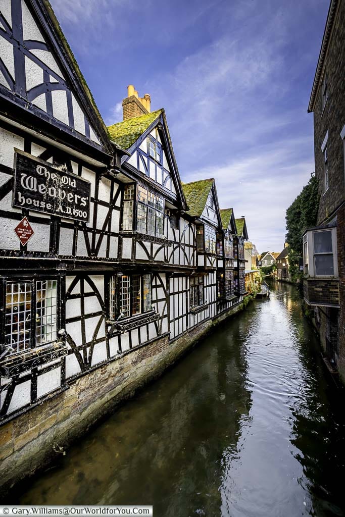 A side shot of the Old Weavers' house alongside a branch of the River Stour running through Canterbury