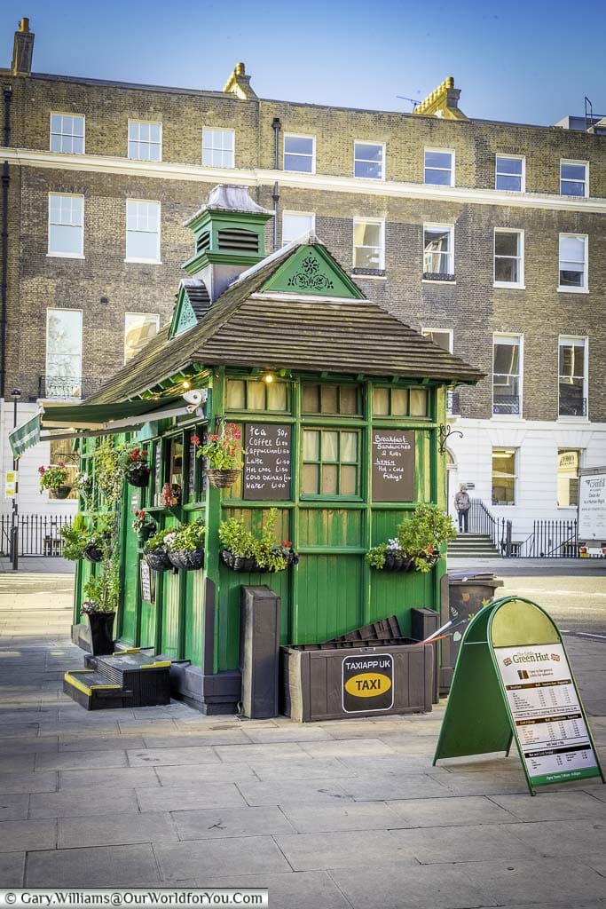 A traditional green wooden cabbie cabin offering shelter, food an drink to taxi drivers on russell square in holborn