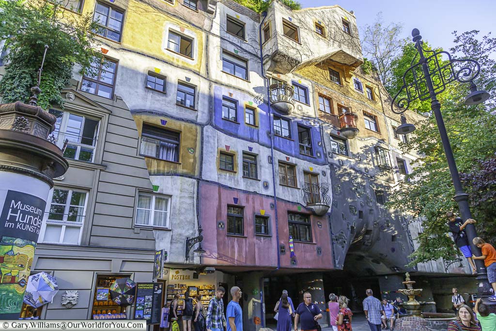 The Hundertwasserhaus, an apartment house styled by an abstract artist where the formality of Austrian architecture is morphed into abstract coloured blocks.