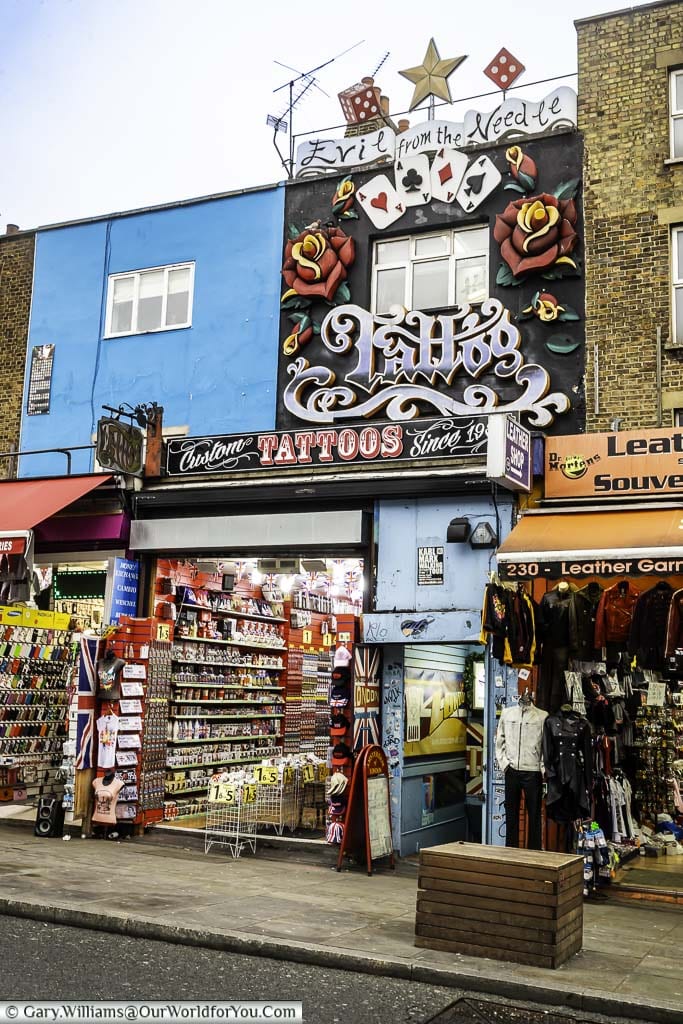 The ornate facade for 'Evil from the Needle', Tattooist, above a gift shop in Camden